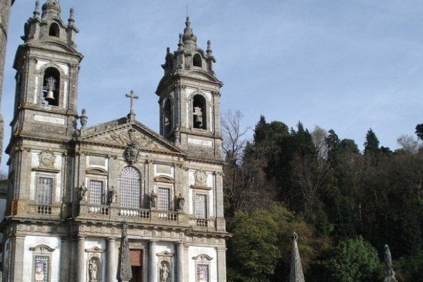 A stunning view of Bom Jesus church in Braga, featuring a tall tower and grand steps leading up to it.