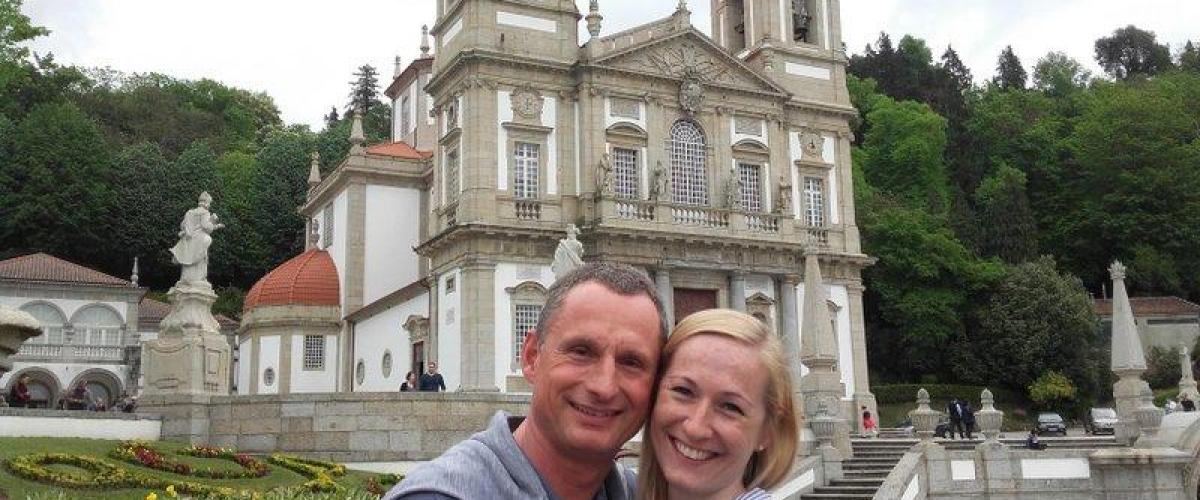 A couple poses happily for a selfie outside Bom Jesus Church, cherishing their time during the Braga Tour adventure.