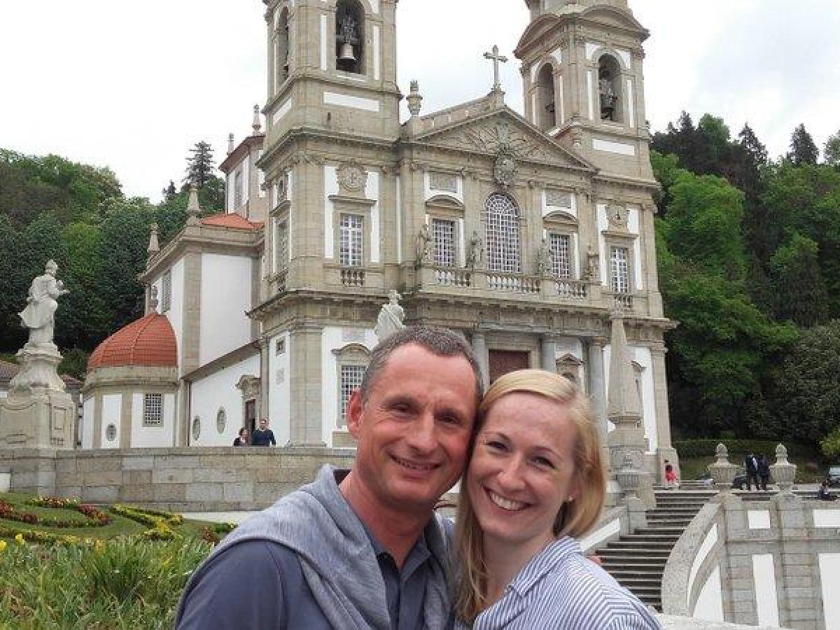 A couple poses happily for a selfie outside Bom Jesus Church, cherishing their time during the Braga Tour adventure.