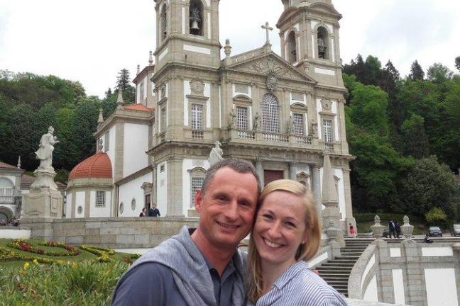 A couple poses happily for a selfie outside Bom Jesus Church, cherishing their time during the Braga Tour adventure.
