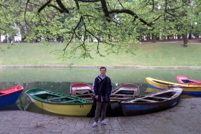 A man stands proudly on a boat, taking in the stunning views at Bom Jesus, enjoying a perfect day on the water.
