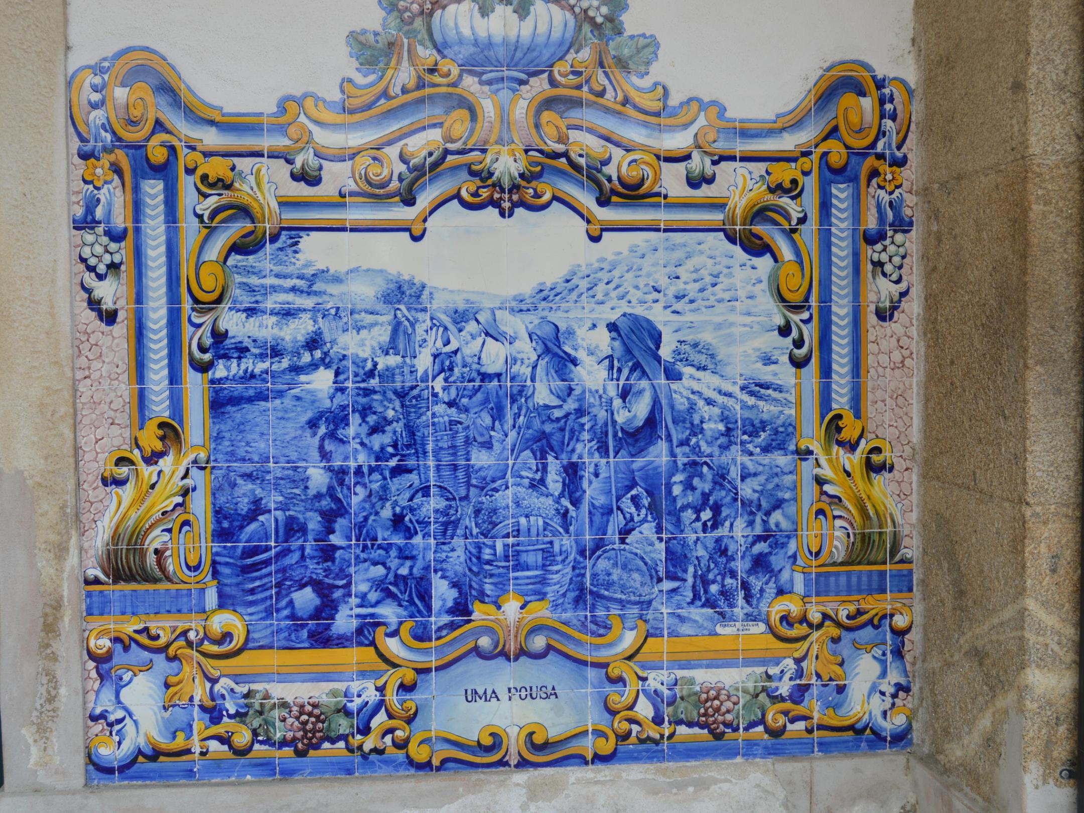 A close-up of a blue and white tile at the Pinhão train station, showcasing intricate patterns and vibrant colors.