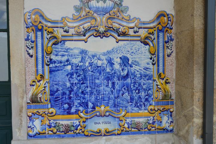 A close-up of a blue and white tile at the Pinhão train station, showcasing intricate patterns and vibrant colors.