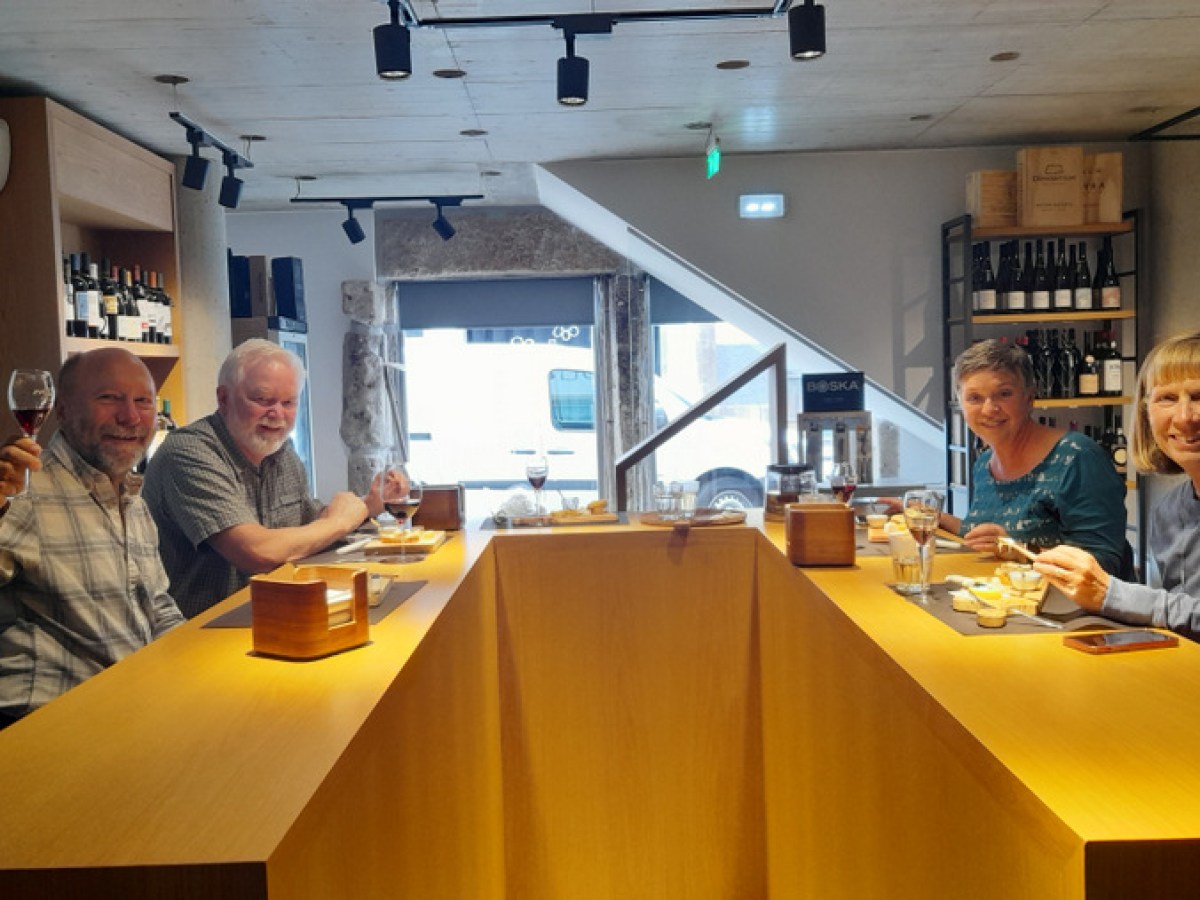 a group of people eating cheese during braga food tour