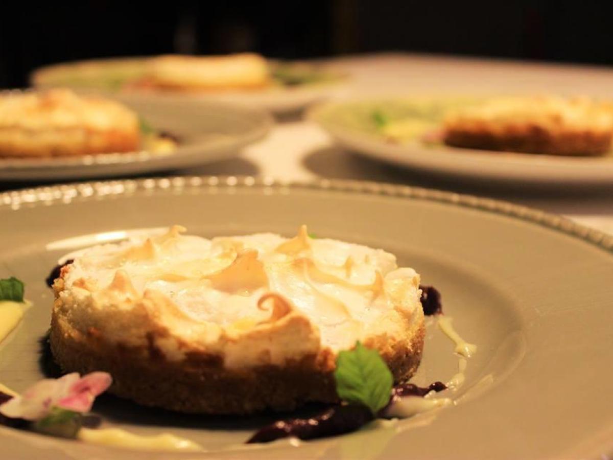 A tempting plate of Portuguese desserts beautifully arranged on a table, perfect for food tour enthusiasts.