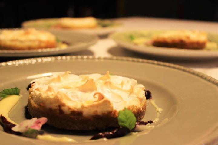 A tempting plate of Portuguese desserts beautifully arranged on a table, perfect for food tour enthusiasts.
