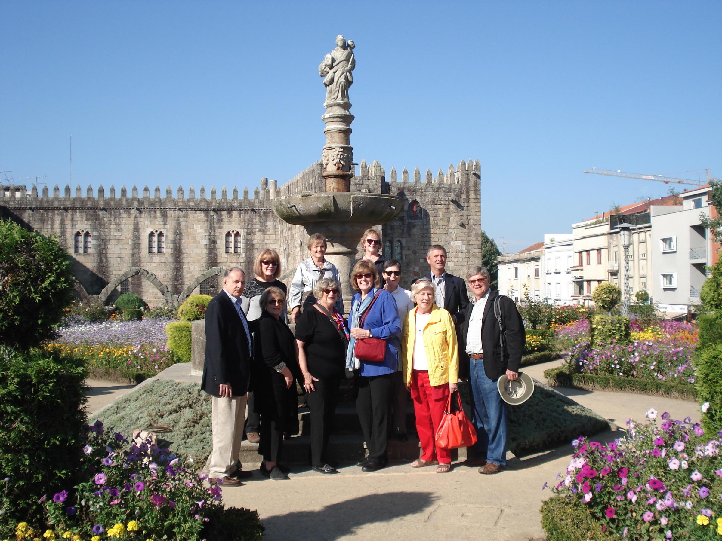 A lively group poses for a picture, celebrating their experiences and connections formed on the Braga Tour adventure.