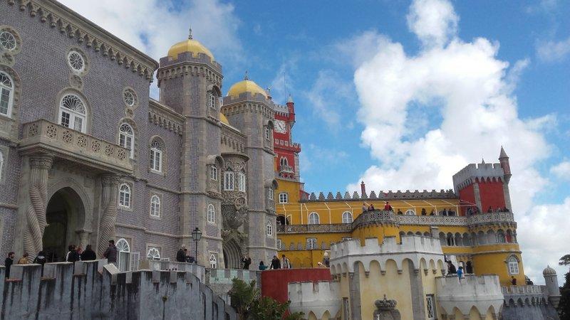 The impressive Pena Palace, with its size and colours, dominates the landscape.