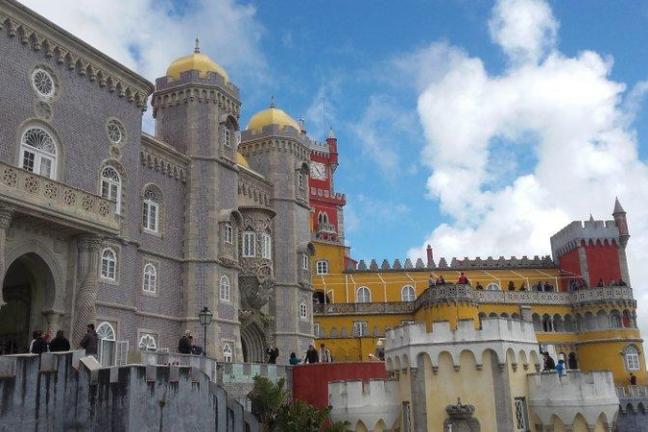 The impressive Pena Palace, with its size and colours, dominates the landscape.