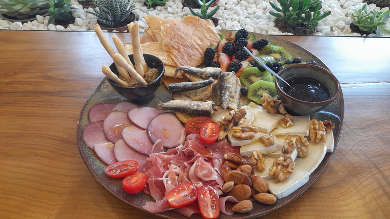 A beautifully arranged plate of gourmet food on a table, showcasing dishes from the Olive Oil Porto food tour.