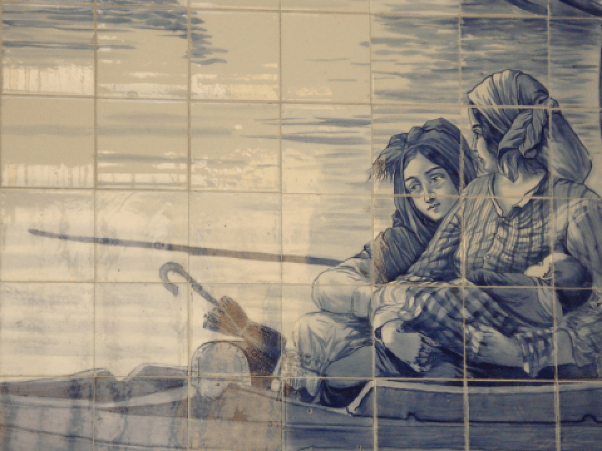 A vibrant blue and white tile mural shows two people in a boat, capturing the essence of Porto's scenic walking tours.