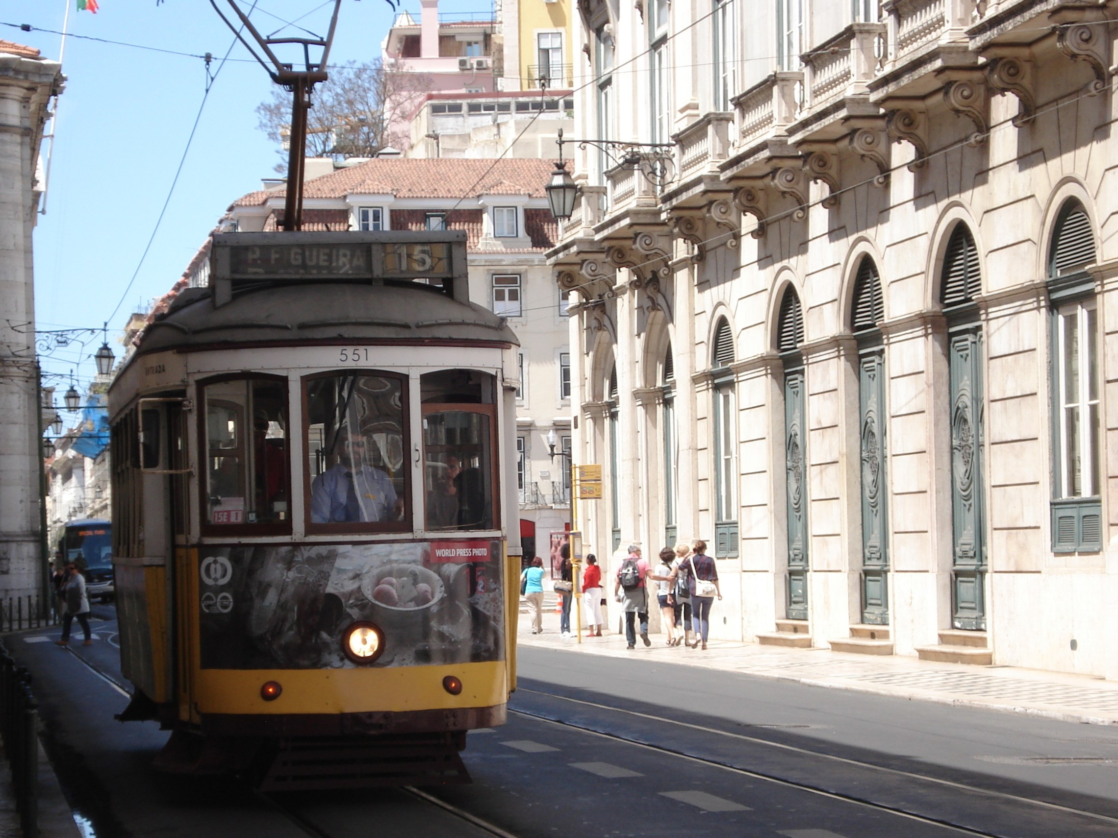 a tram is parked on the side of a building