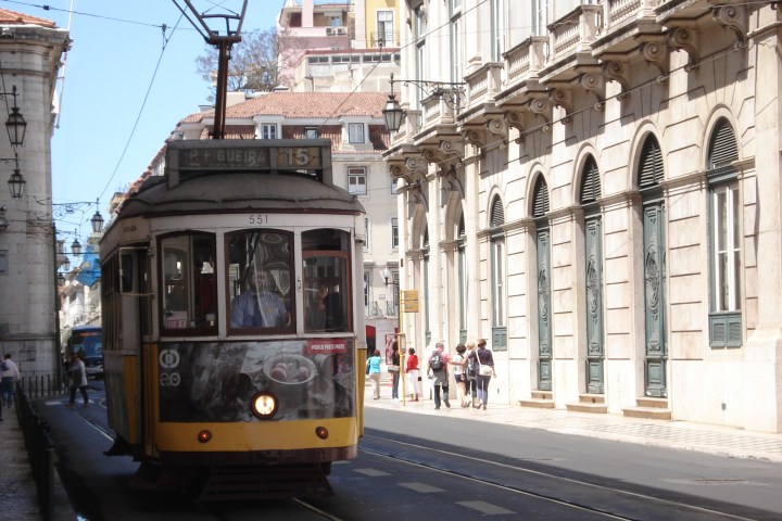 a tram is parked on the side of a building