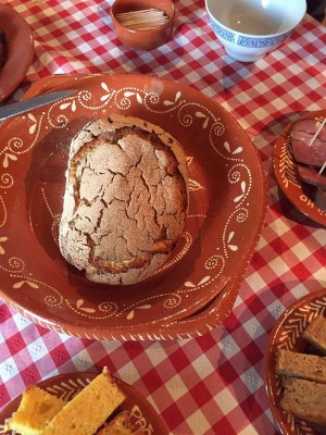 a plate of food with a slice of cake on a table