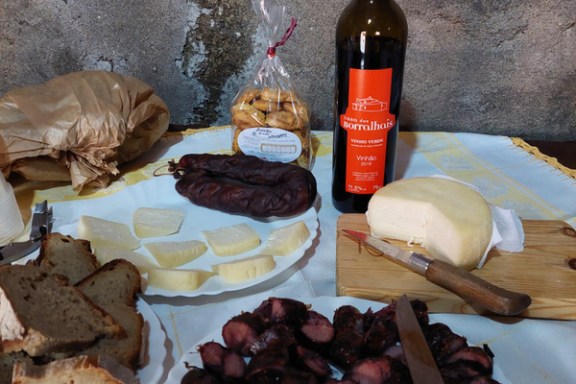a plate of food on a table during portugal food tour