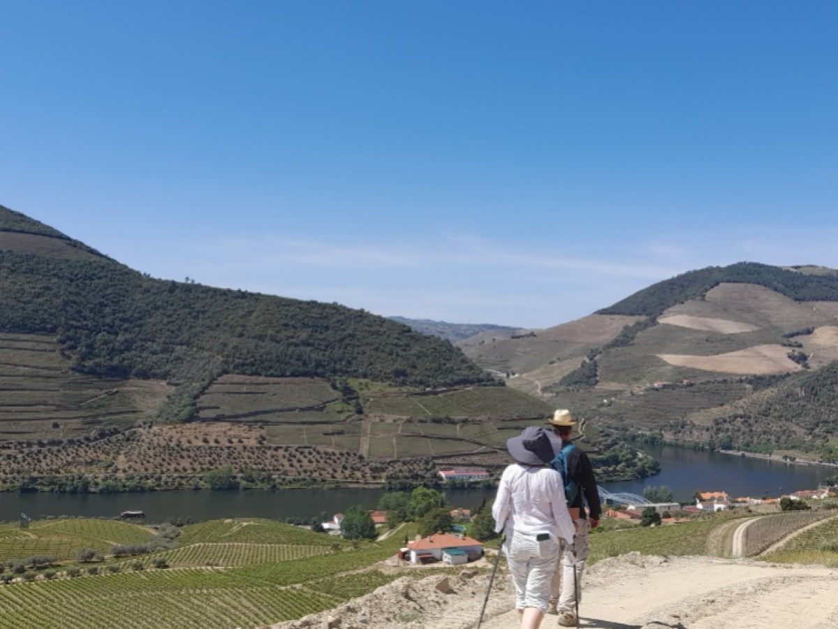 a couple enjoying the breathtaking views of the Douro Valley on a hike.