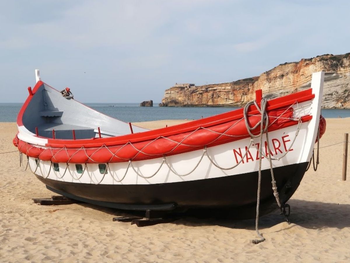 sand beach and boat in Nazare, Portugal