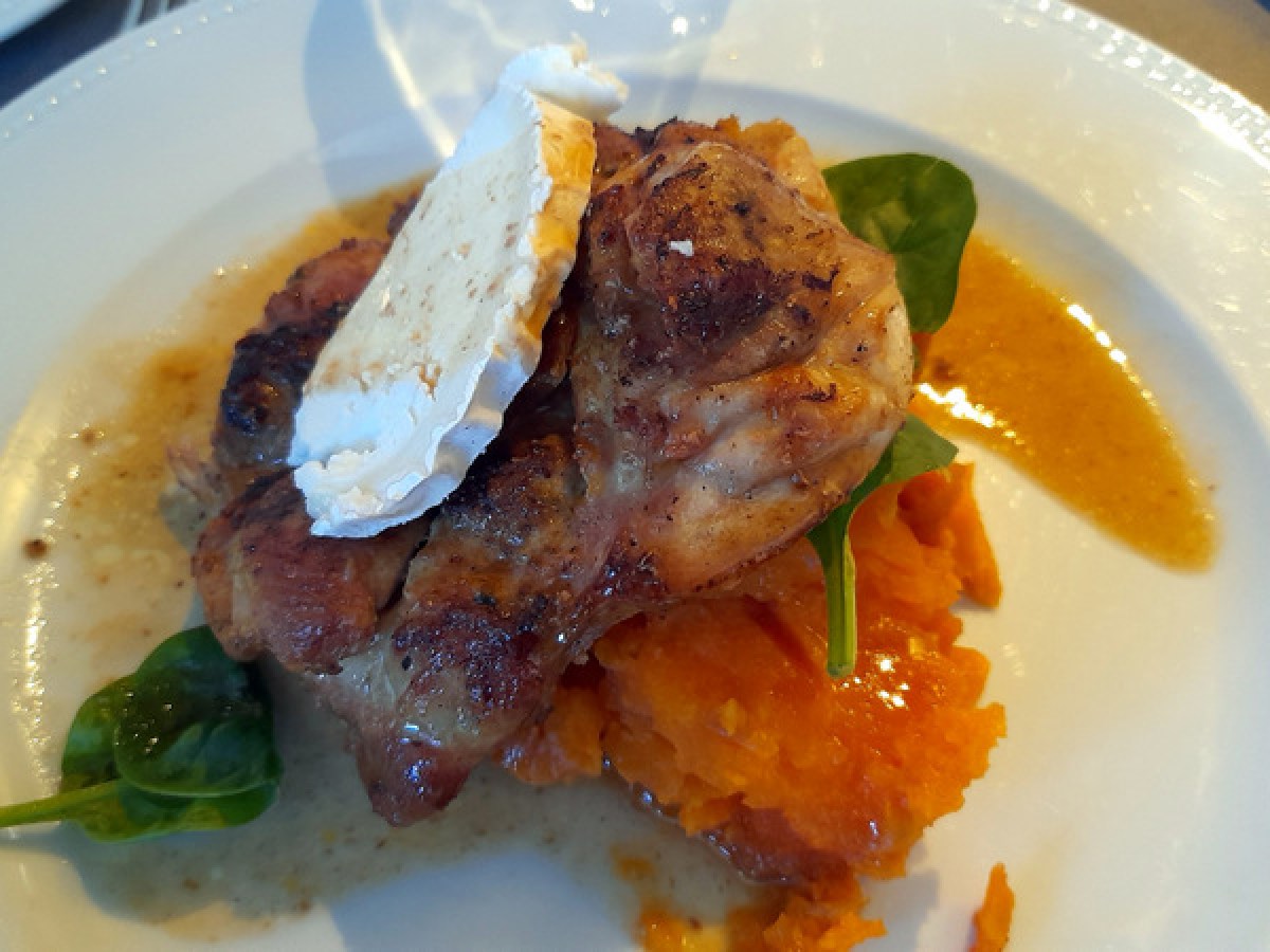 a plate of pork and sweet potatoes portuguese cuisine