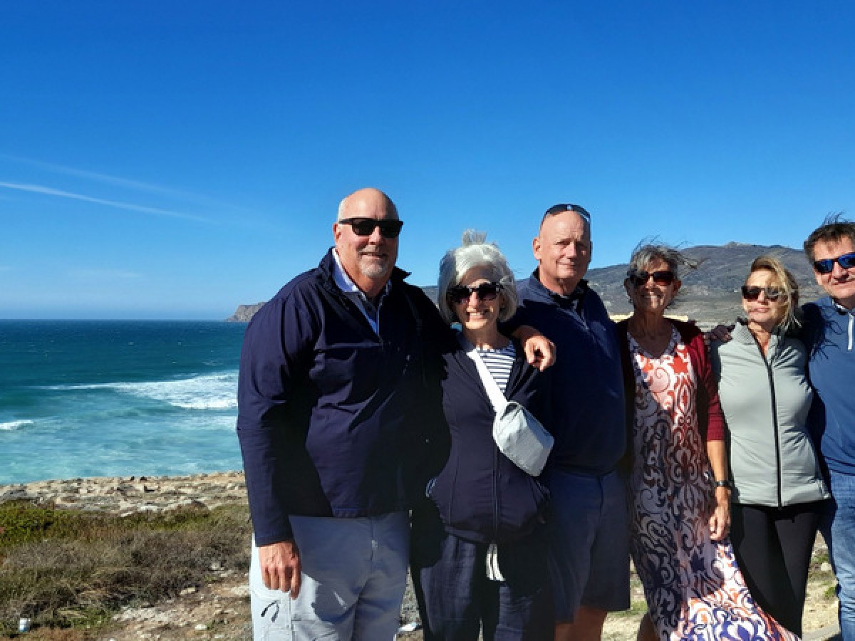 a group of people on a beach during portugal tours