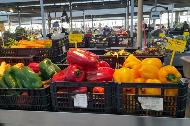 a bunch of piper on display in a store market food tour portugal