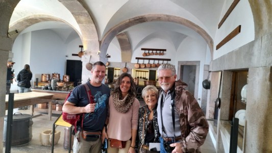 a man and a woman standing in pena palace