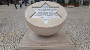 a sign in front of a statue jewish tours portugal