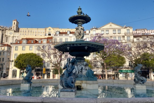 a statue in rossio square in Lisbon