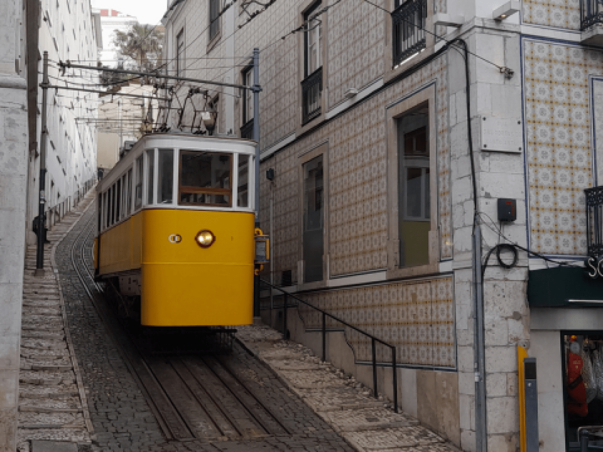 The yellow funicular in Lisbon, highlighting the excitement of exploring the city on a tour.
