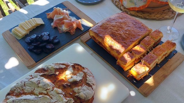 A beautifully set table showcasing Portugal's hidden culinary gems, featuring delicious food and exquisite local wines.