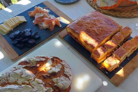 A beautifully set table showcasing Portugal's hidden culinary gems, featuring delicious food and exquisite local wines.