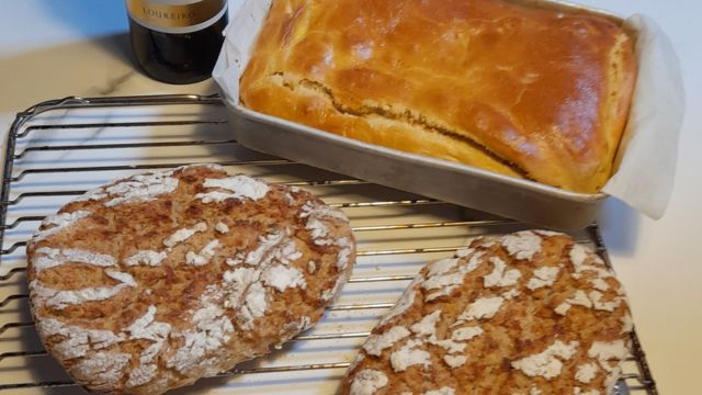 Cornbread and chorizo bread rest on a cooling rack, invitingly prepared for a wine tasting on a Lisbon food tour.