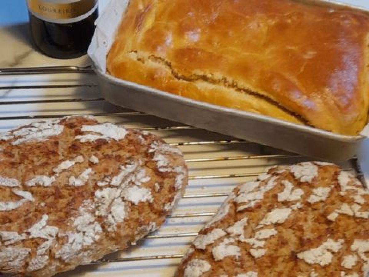 Cornbread and chorizo bread rest on a cooling rack, invitingly prepared for a wine tasting on a Lisbon food tour.