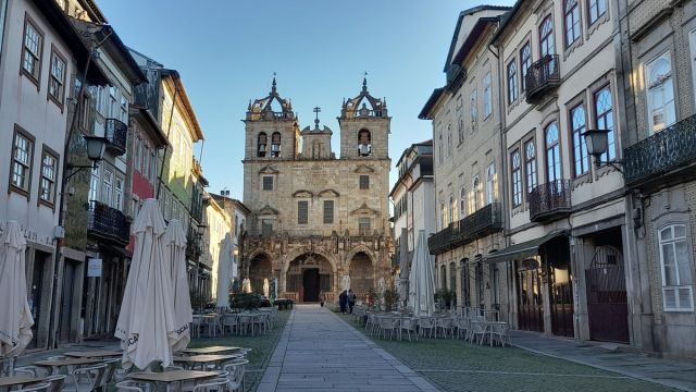 a group of people walking in front of a building