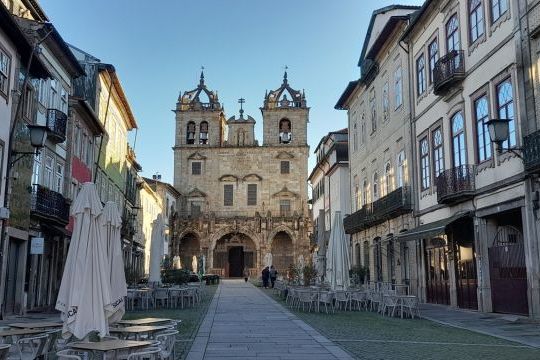a group of people walking in front of a building